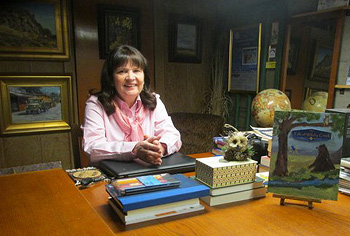 Vicki at her desk